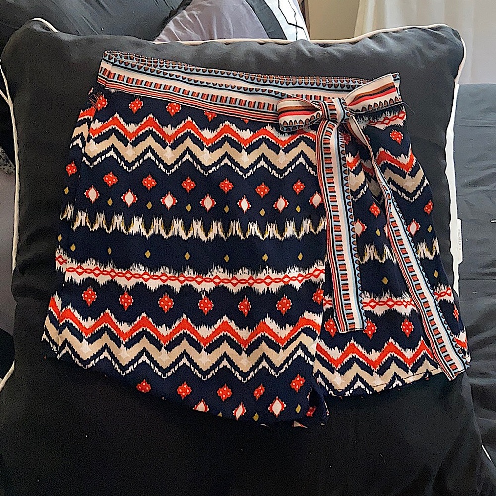 Small faux wrap around polyester skort.